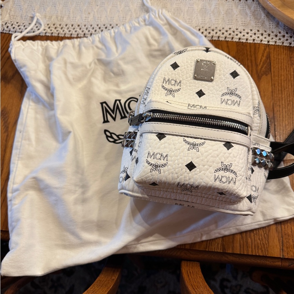 MCM Backpack in White with Black never used.  Gold Accents on side pockets